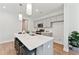 Modern kitchen with island, stainless steel appliances, and white quartz countertops at 418 Queenview Ln, Charleston, SC 29414