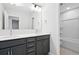 Bathroom features double sinks, quartz countertops, and shower with tiled enclosure at 479 Green Fern Dr, Summerville, SC 29483