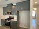 Kitchen featuring gray cabinetry, stainless steel appliances, and efficient layout at 479 Green Fern Dr, Summerville, SC 29483