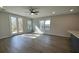 Open floor plan in a living room featuring neutral walls, ceiling fan and natural lighting at 479 Green Fern Dr, Summerville, SC 29483