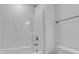 Clean bathroom with a white tub and shower combination and neutral finishes at 385 Wappoo Trace Ln, Summerville, SC 29486