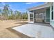 Charming screened porch with concrete patio overlooking the private backyard, perfect for relaxing or entertaining at 385 Wappoo Trace Ln, Summerville, SC 29486