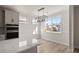 Bright kitchen nook with large windows and stylish chandelier at 379 Wappoo Trace Ln, Summerville, SC 29486