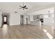 Open concept living room and kitchen with high ceilings and luxury vinyl plank flooring at 379 Wappoo Trace Ln, Summerville, SC 29486