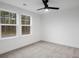 Bedroom with carpet, ceiling fan and two windows at 537 Rendezvous Way, Huger, SC 29450