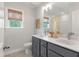 Bright bathroom with double sink vanity, neutral paint, and window with a view at 111 Ashley Cove Way, Summerville, SC 29483