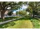 Enjoy a serene community green space with lush grass, mature trees, and walking paths at 111 Ashley Cove Way, Summerville, SC 29483