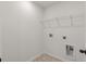 Empty laundry room with a wire rack for storage above hookups at 111 Ashley Cove Way, Summerville, SC 29483