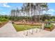 A community playground features slides, swings, and climbing structures in a natural setting at 111 Ashley Cove Way, Summerville, SC 29483