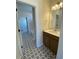 Bathroom with star pattern tile flooring, vanity, and open doorway to the tub at 502 Fiskdale Cir, Summerville, SC 29486