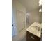 Bright bathroom featuring a dual sink vanity with a shower in background at 502 Fiskdale Cir, Summerville, SC 29486