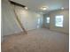 Bonus room featuring an unfinished attic access, windows, and neutral carpeting at 502 Fiskdale Cir, Summerville, SC 29486