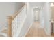 Light-filled hallway with hardwood floors and staircase at 132 Cantona Dr, Summerville, SC 29483