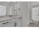 Modern bathroom featuring a white vanity with black hardware, and a large mirror at 383 Wappoo Trace Ln, Summerville, SC 29486
