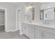 Bathroom featuring a double sink vanity, tile flooring, and doorways to other rooms at 383 Wappoo Trace Ln, Summerville, SC 29486