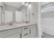 Spacious bathroom with double sinks, modern lighting, and a separate tub/shower area at 383 Wappoo Trace Ln, Summerville, SC 29486