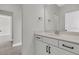 Modern bathroom featuring a white vanity with black hardware, and a large mirror at 383 Wappoo Trace Ln, Summerville, SC 29486