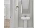 Stylish powder room featuring a pedestal sink and modern fixtures at 383 Wappoo Trace Ln, Summerville, SC 29486