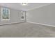 Spacious bedroom with carpet flooring and two windows providing ample natural light at 383 Wappoo Trace Ln, Summerville, SC 29486