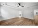Bright bedroom with wood-look floors and en-suite bathroom access at 517 Rendezvous Way, Huger, SC 29450