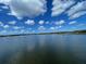 Scenic waterfront view with calm water, boats, and a partly cloudy sky at 517 Rendezvous Way, Huger, SC 29450