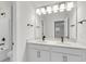 Bathroom with double vanity, quartz countertop, undermount sinks, large mirror and bronze fixtures at 710 Maynard Ln, Summerville, SC 29486