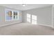 Bright bedroom with neutral walls and plush carpeting, featuring a large window offering ample natural light at 130 Cantona Dr, Summerville, SC 29483