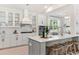 Bright kitchen with white cabinets, center island, and stainless steel appliances at 130 Cantona Dr, Summerville, SC 29483