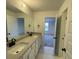 Modern bathroom with double vanity, neutral colors, and elegant fixtures at 521 Rendezvous Way, Huger, SC 29450