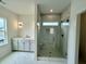 Modern bathroom features a glass shower and a marble-tiled accent wall, and sleek fixtures at 180 Sandy Bend Ln, Summerville, SC 29486