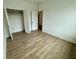 Bedroom with wood floors and closet space for easy storage and organization at 180 Sandy Bend Ln, Summerville, SC 29486