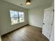 Bedroom with wood floors and a window providing plenty of natural light and community views at 180 Sandy Bend Ln, Summerville, SC 29486