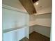 Walk-in closet features shelves and hanging rods providing ample storage space at 180 Sandy Bend Ln, Summerville, SC 29486