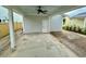 Covered patio features a ceiling fan and access door; space is ready for outdoor living at 180 Sandy Bend Ln, Summerville, SC 29486