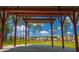 Community pavilion overlooking a green space and colorful townhome exteriors at 407 Swaying Pine Ln, Summerville, SC 29486