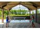 Community game room with ping pong and shuffleboard offer a relaxing outdoor activity space at 407 Swaying Pine Ln, Summerville, SC 29486