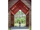 Biker on a community walking path with scenic views and beautiful wooden pergola at 407 Swaying Pine Ln, Summerville, SC 29486