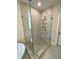 Luxury bathroom featuring a glass enclosed shower with high-end fixtures and marble style tile at 704 Maynard Ln, Summerville, SC 29486