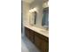 Bright bathroom featuring a double vanity with a white countertop and modern fixtures at 704 Maynard Ln, Summerville, SC 29486