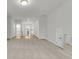 Bright, neutral-toned bedroom features carpet flooring and a hallway with natural light at 704 Maynard Ln, Summerville, SC 29486