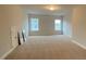 Spacious bedroom with plush carpeting and two large windows providing natural light at 704 Maynard Ln, Summerville, SC 29486