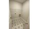 Clean laundry room with gray star pattern tile and wire shelving at 704 Maynard Ln, Summerville, SC 29486