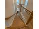 Staircase with wood treads and white painted risers and railing at 704 Maynard Ln, Summerville, SC 29486