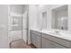 Bathroom featuring double vanity with white countertop and grey cabinets at 2163 Macallan Blvd, Ravenel, SC 29470