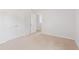 Bright bedroom featuring neutral carpet, white walls, and a closet with double doors at 2163 Macallan Blvd, Ravenel, SC 29470