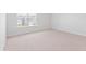 Bedroom with neutral carpet, white trim, and natural light at 2163 Macallan Blvd, Ravenel, SC 29470