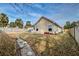 Expansive backyard featuring an outdoor patio area with a decorative rock garden and a partial fence at 7034 Lanier St, Hanahan, SC 29410