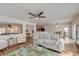 Inviting living room with ceiling fan, hardwood floors, open layout, and abundant natural light at 7034 Lanier St, Hanahan, SC 29410