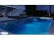 Inviting pool and spa with waterfall feature at night at 1104 Beresford Run, Charleston, SC 29492