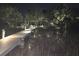 Waterfront property featuring a private dock, illuminated for evening enjoyment on the lake at 1374 Black River Dr, Mount Pleasant, SC 29466